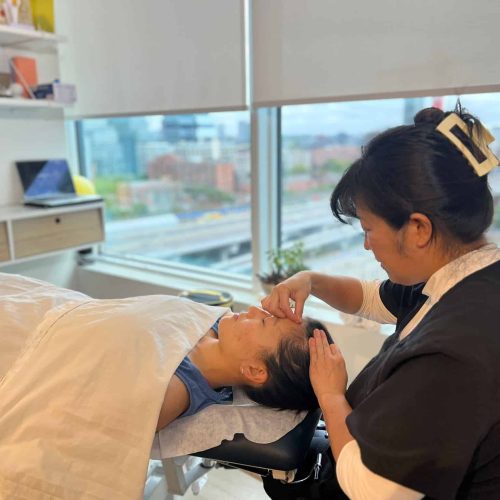 Patient receiving acupuncture therapy at Restoracare Health