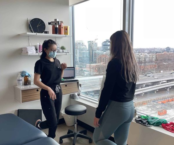 two woman in black doing Physiotherapy