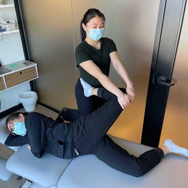 Professional chiropractor performing back adjustment