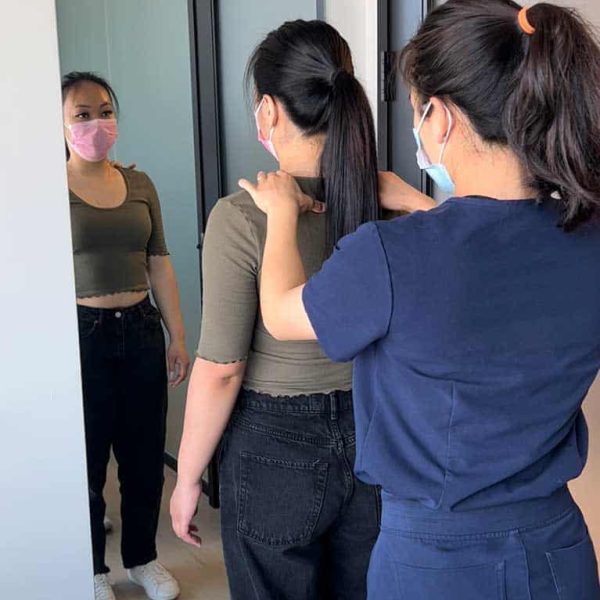 Therapist applying gentle neck adjustment technique